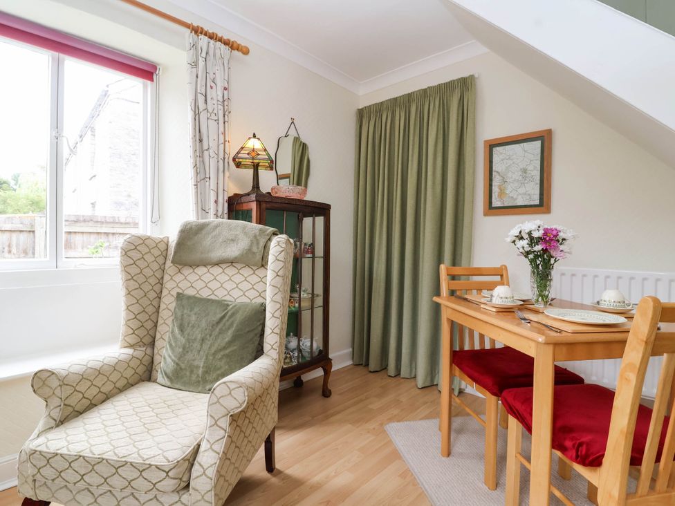 A dining area with a table and chairs at 96 Chapel Lane Butleigh
