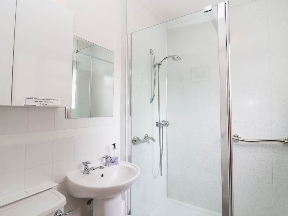 A bathroom with shower and sink at 96 Chapel Lane Butleigh