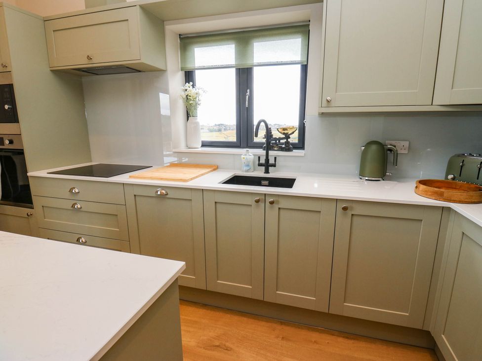 A kitchen with sink and countertop at The Stables in Stainland