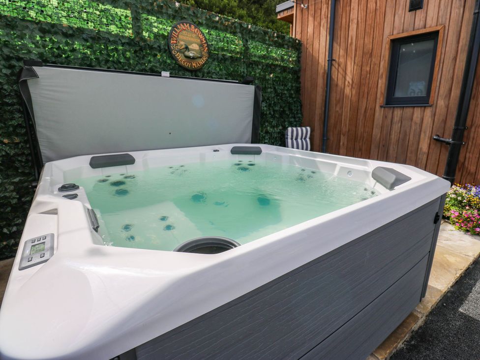 A hot tub with water and a control panel at The Stables in Stainland