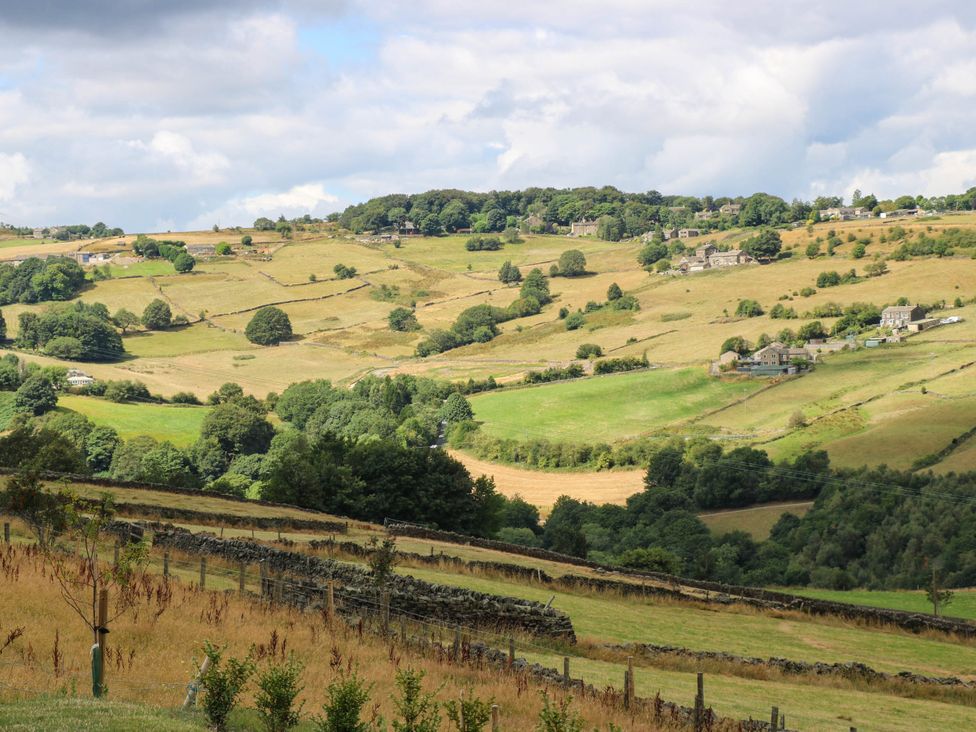 A rural landscape with fields and houses at The Stables in Stainland