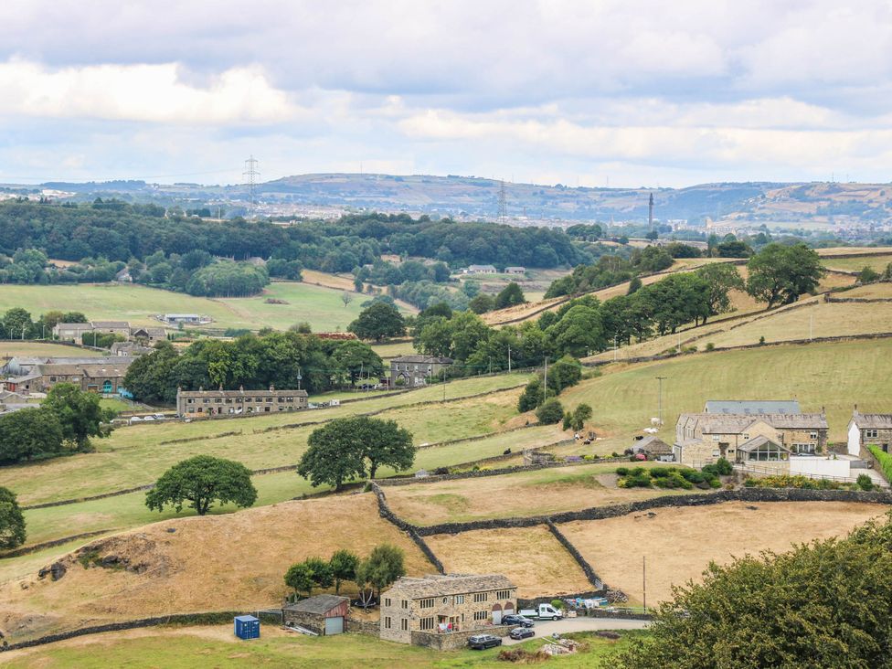 A landscape view with fields and buildings at The Stables in Stainland
