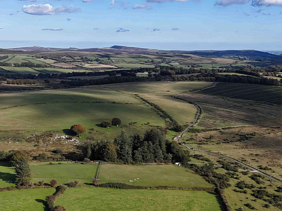 A landscape with fields and trees at Goldcrest in Postbridge