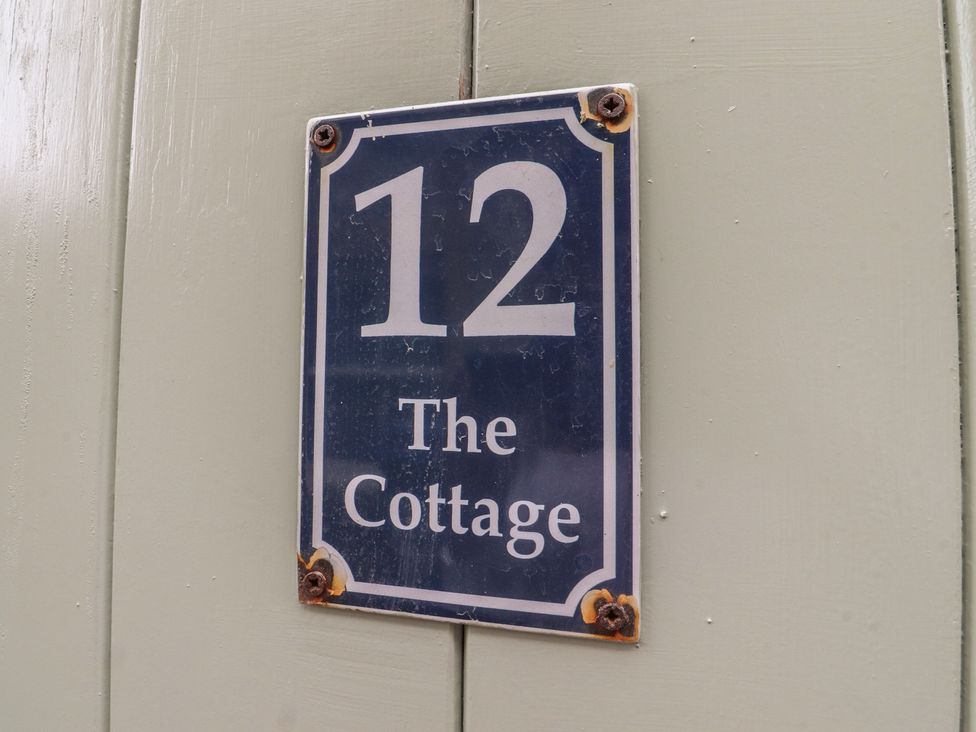 House number and name plate for The Cottage in Giggleswick