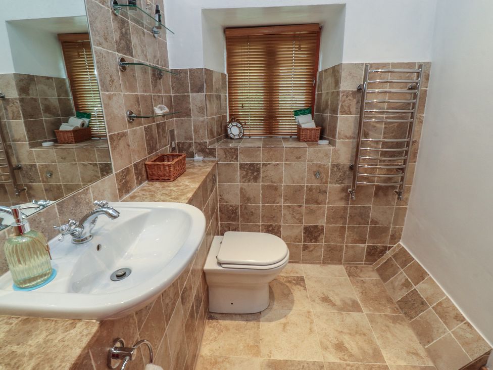 A bathroom with a sink and toilet at The Cottage in Giggleswick