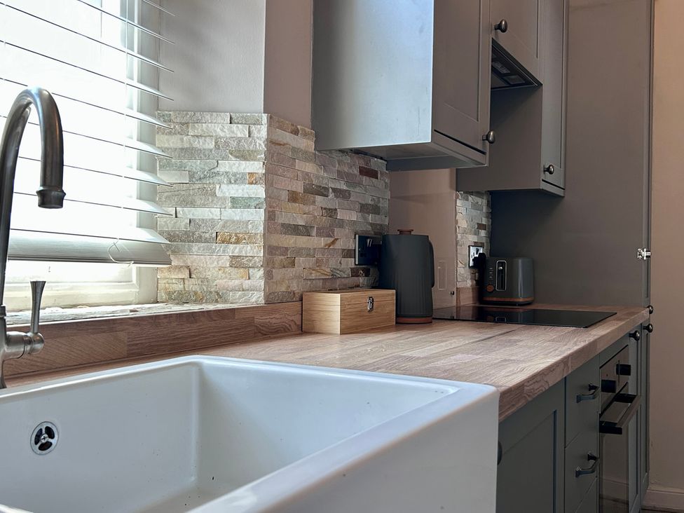 A kitchen with a sink and countertop at Downton I in Alnwick