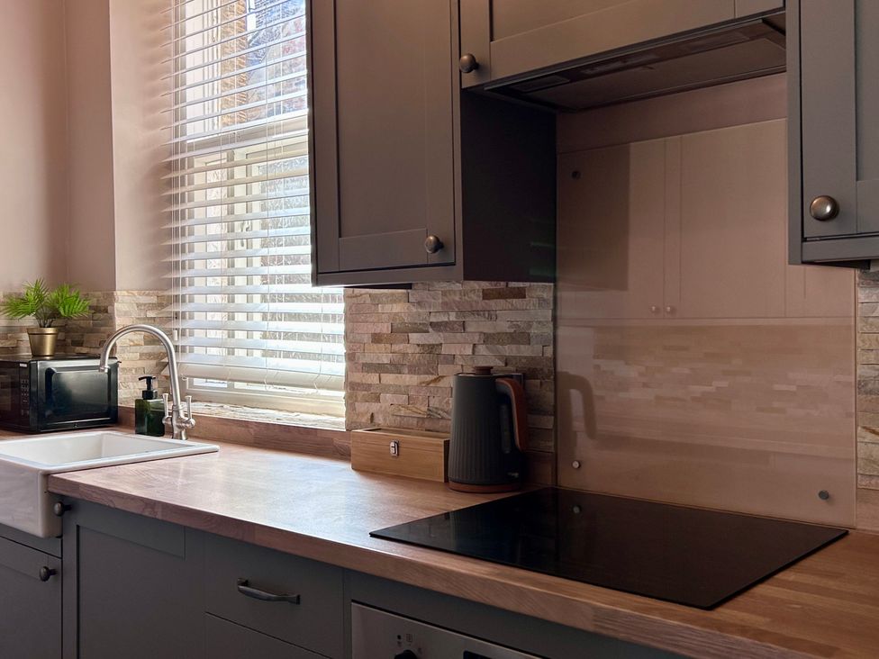 A kitchen with a sink and microwave at Downton I Alnwick