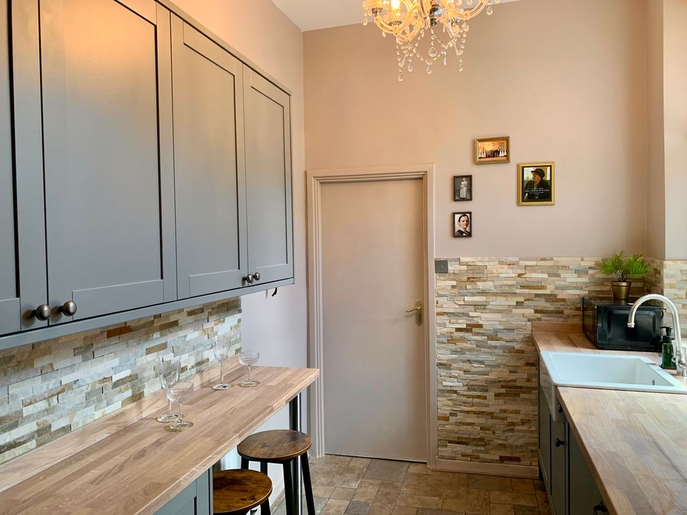 A kitchen with cabinets and a countertop at Downton I Alnwick