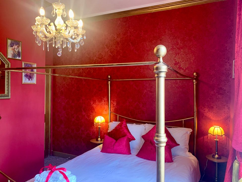 A bedroom with a bed and bedside tables at Downton I in Alnwick