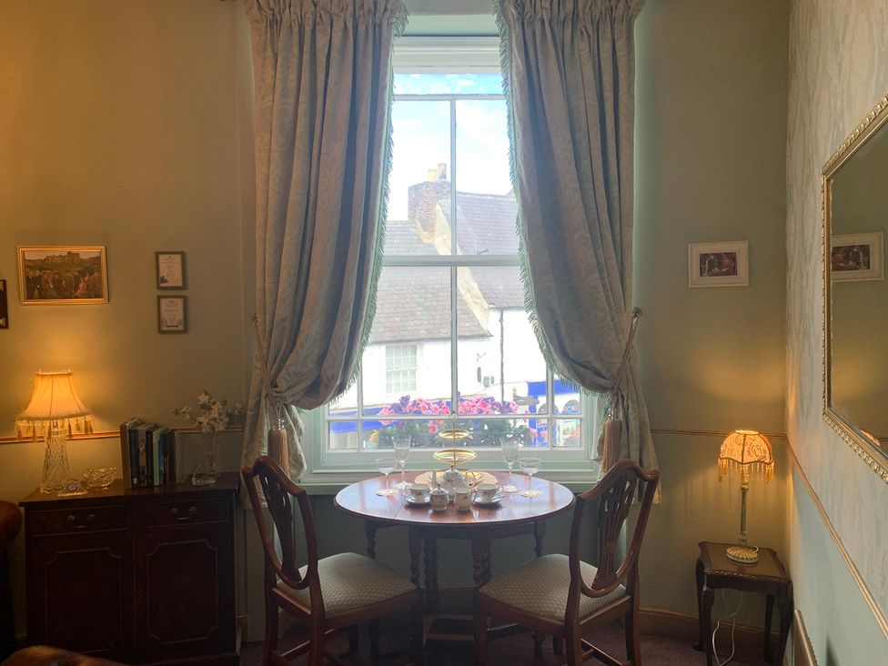 A dining room with a table and chairs at Downton I Alnwick