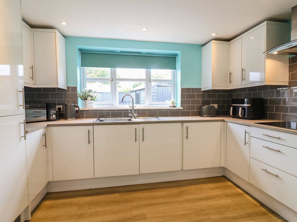 A kitchen with a sink and appliances at Frome View in Wool