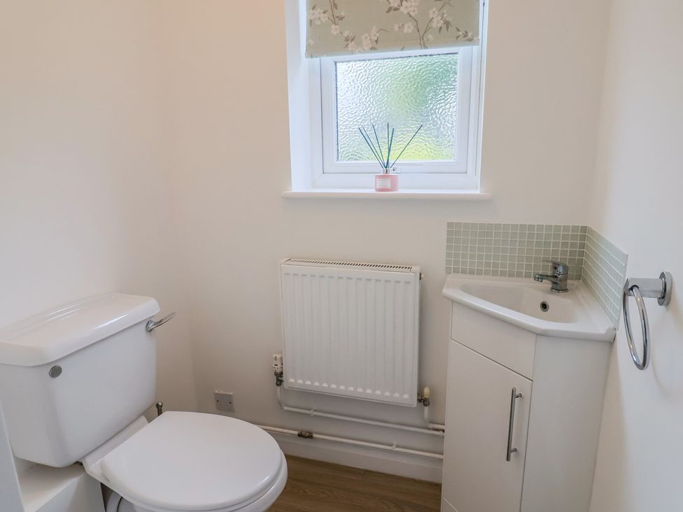 A bathroom with a toilet and wash basin at Frome View Wool