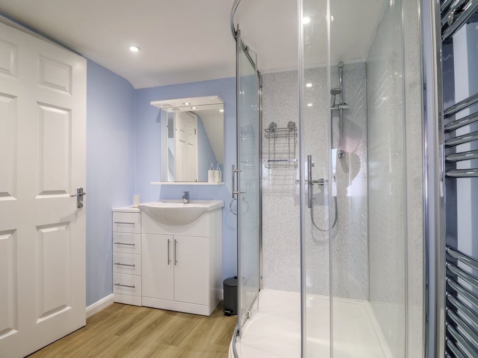 A bathroom with a shower and sink at Frome View in Wool