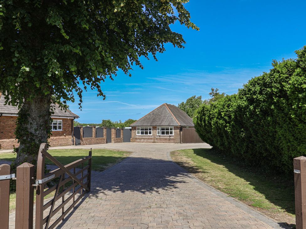 An outdoor view of a building with a driveway at Frome View in Wool