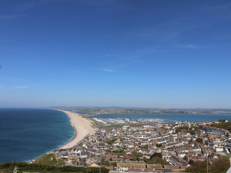 A view of a beach and town from a height at Frome View Wool