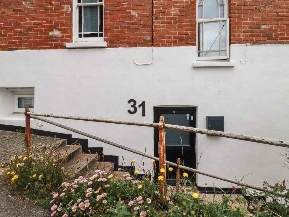 A building with a door and flowers at 31 Tregoney Hill Mevagissey