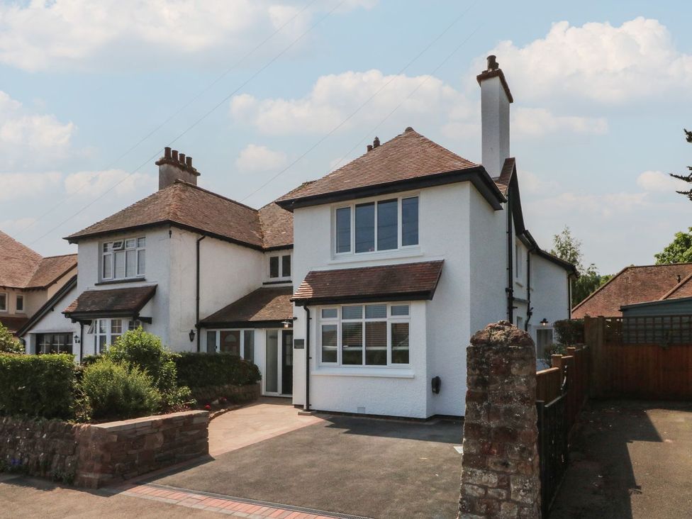 A house with windows and a driveway at Wendy's Cottage Minehead