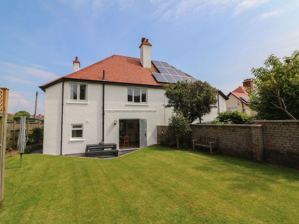 A house with solar panels and a garden at Wendy's Cottage in Minehead