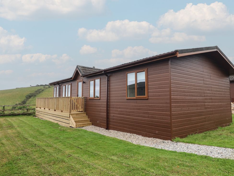 A building with a deck and windows at Lodge 19 in Torpoint