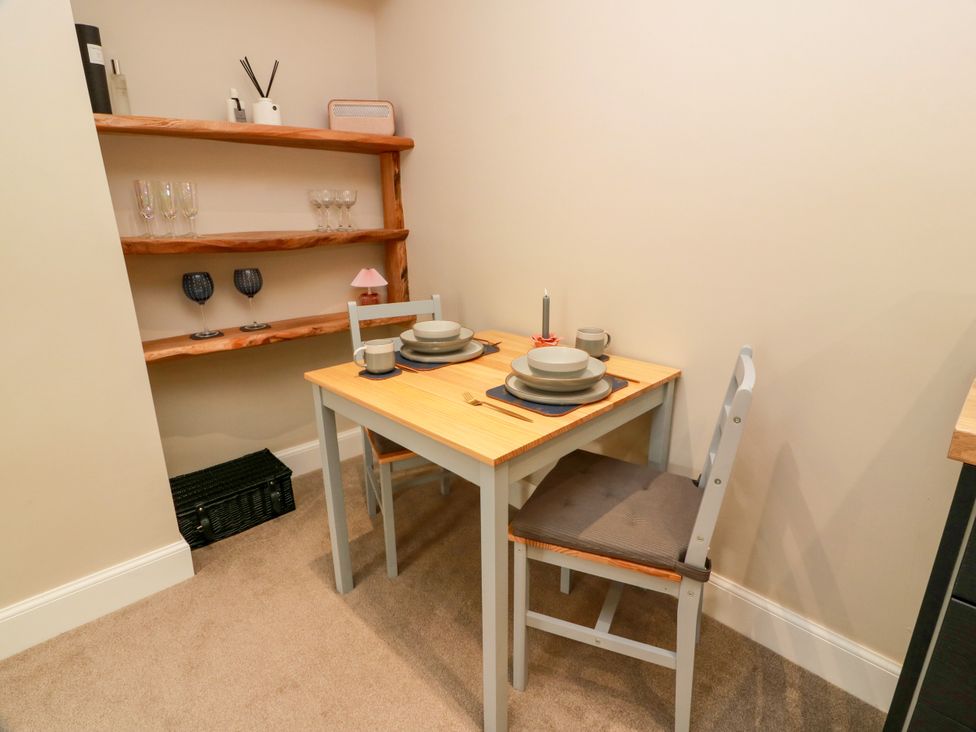A dining area with a table and chairs at 19 Biggiesknowe Peebles