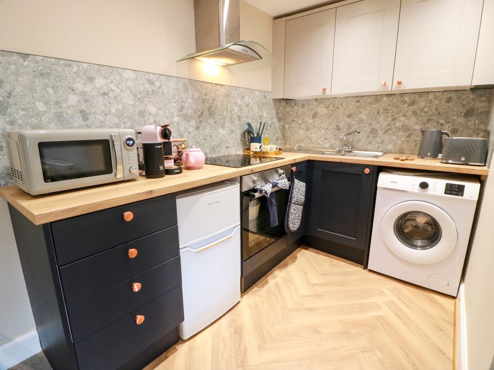 A kitchen with appliances and a countertop at 19 Biggiesknowe in Peebles