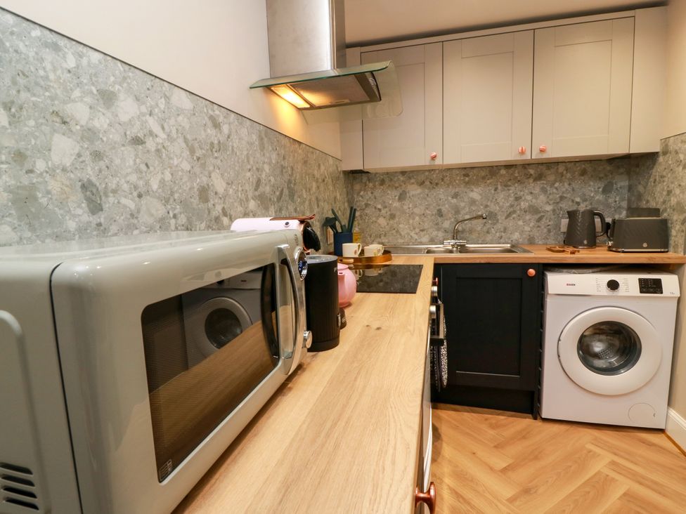 A kitchen with appliances and sink at 19 Biggiesknowe in Peebles
