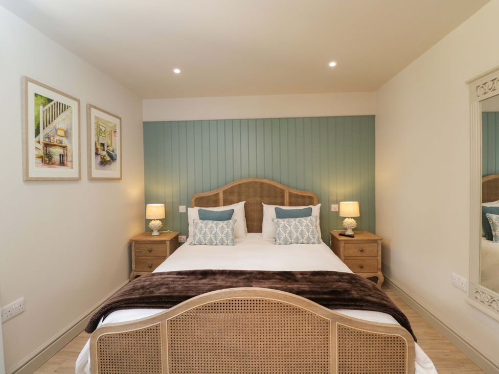 A bedroom with a bed and nightstands at Poppy Patch in Stratton Audley near Bicester