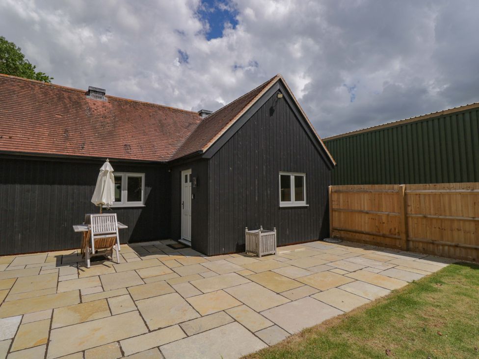 An outdoor area with patio and furniture at Poppy Patch in Stratton Audley near Bicester