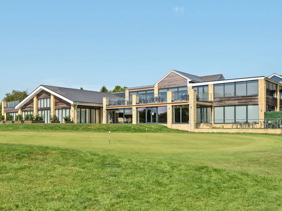 A building with large windows and balconies at Cotswolds Apartments 2B/S4 in Chipping Norton