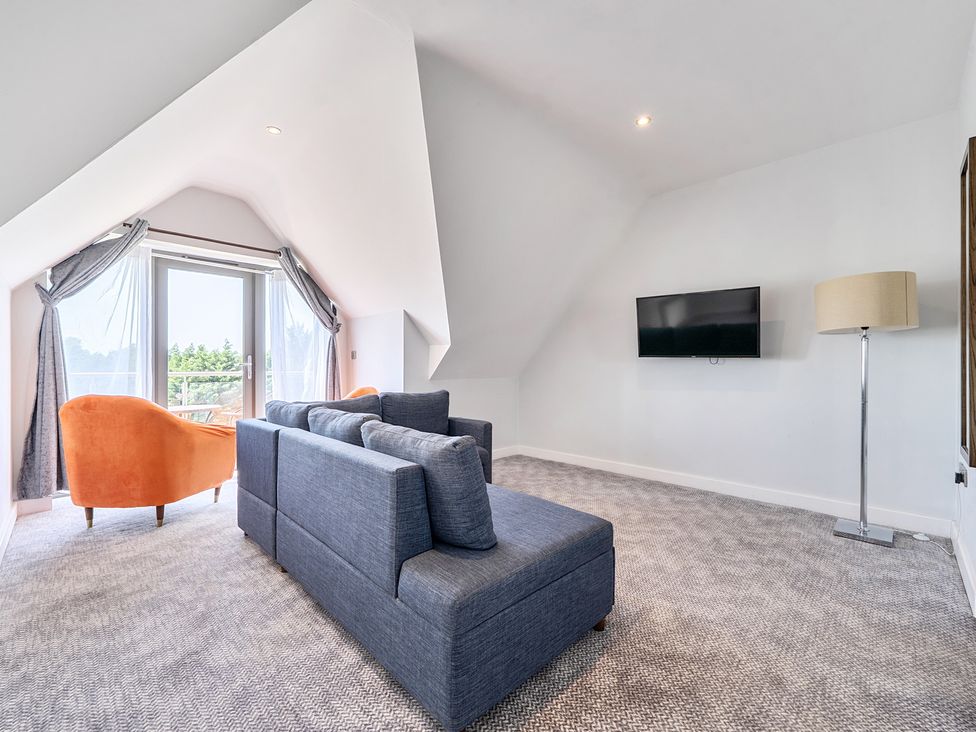 A living room with a sofa and armchair at Cotswolds Apartments 4B/S8 Chipping Norton