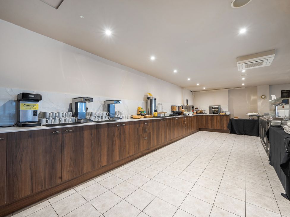 A kitchen with a coffee machine and cups at Cotswolds Apartments 4B/S8 in Chipping Norton
