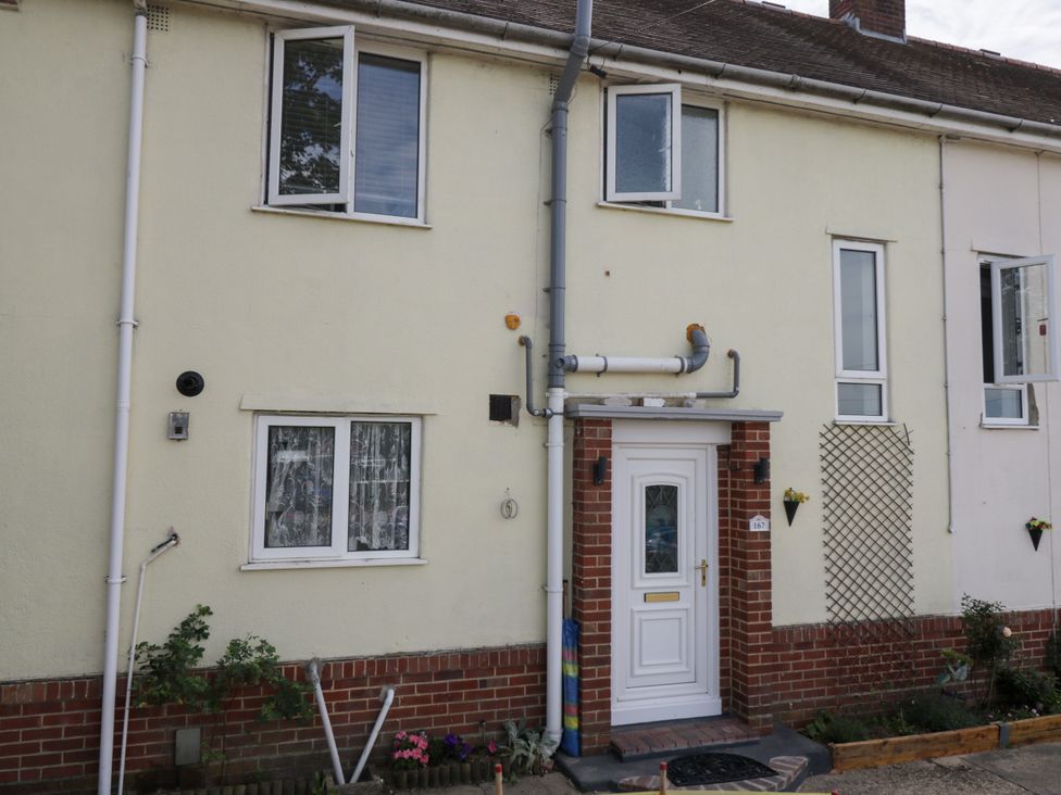 An exterior view of a house with windows and a door at 167 Leybourne Avenue Bournemouth