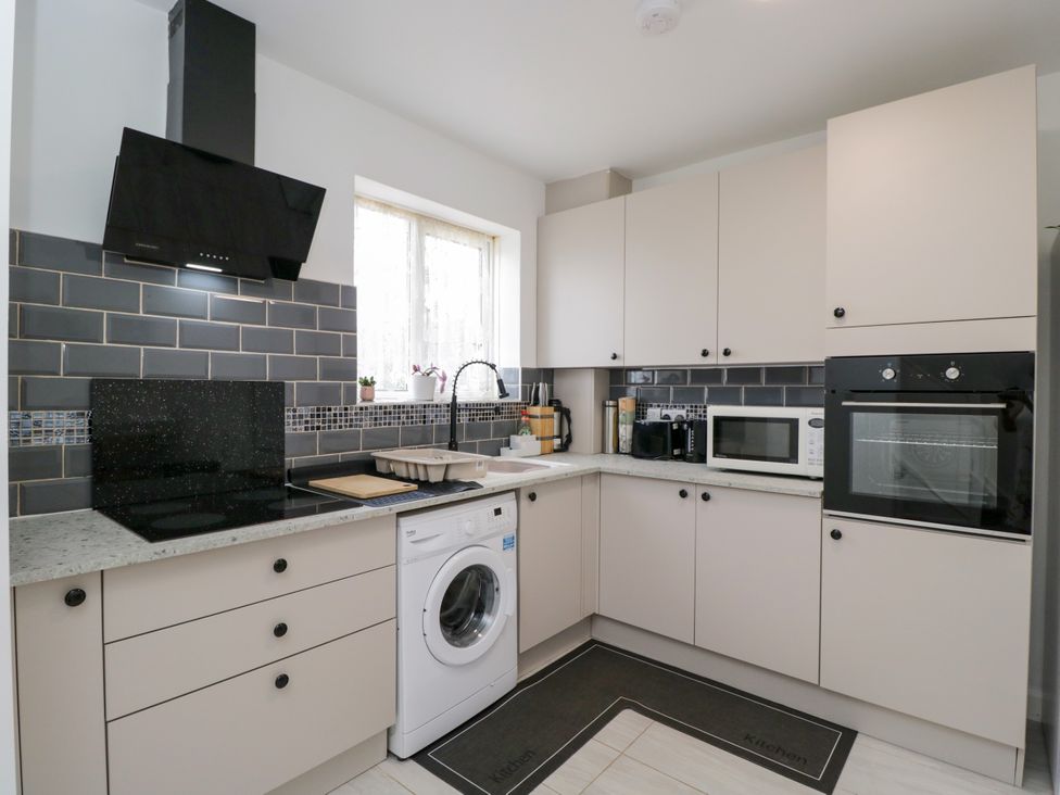 A kitchen with appliances and cabinets at 167 Leybourne Avenue in Bournemouth