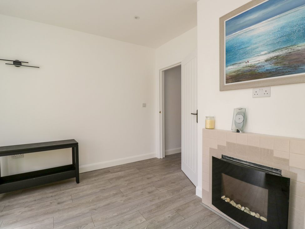 A living room with a console table and fireplace at 167 Leybourne Avenue Bournemouth