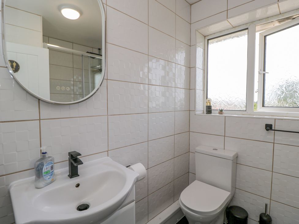 A bathroom with a sink and toilet at 167 Leybourne Avenue Bournemouth