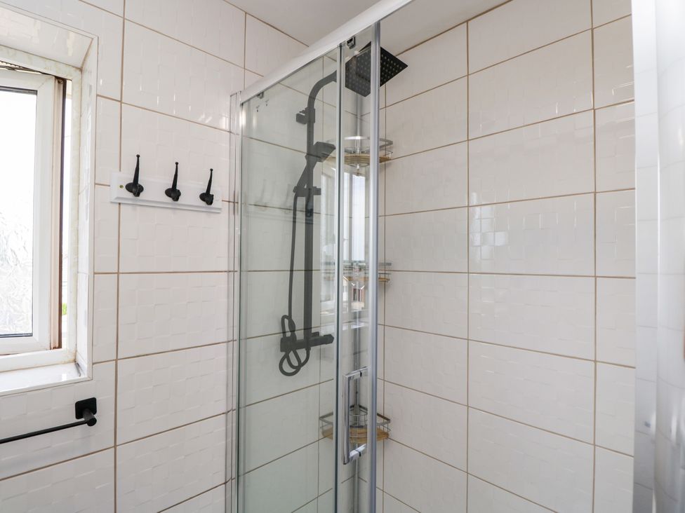 A shower area with a window and hooks at 167 Leybourne Avenue Bournemouth