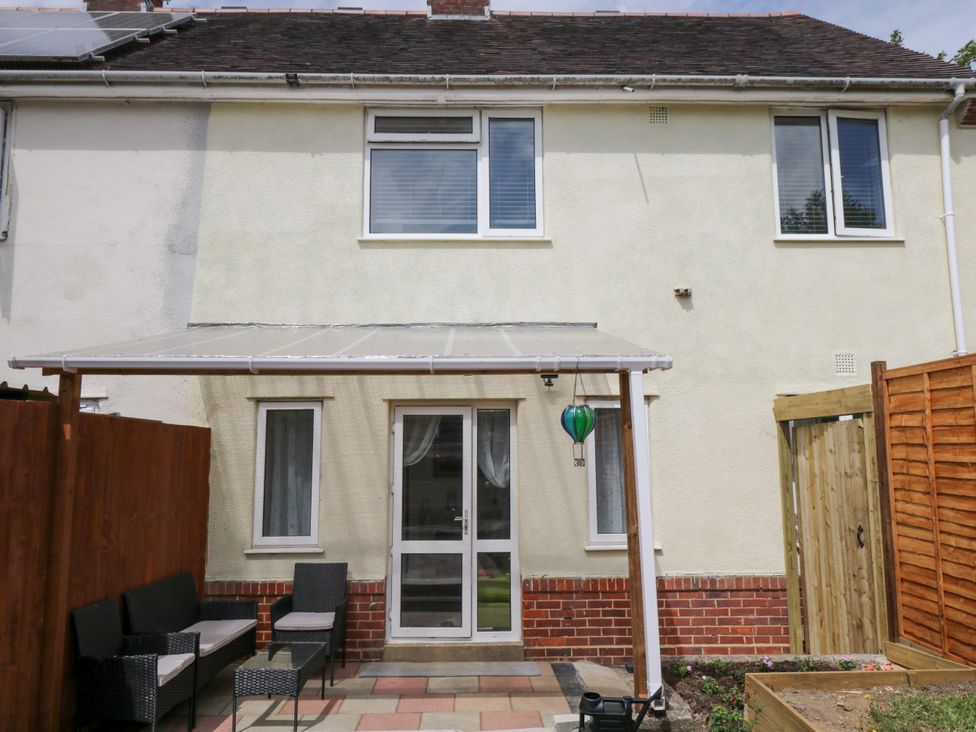 An outdoor area with patio furniture and a door at 167 Leybourne Avenue Bournemouth