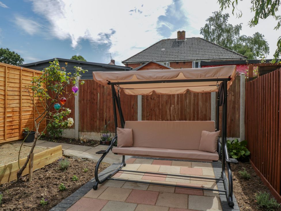 A swing seat in a garden at 167 Leybourne Avenue Bournemouth