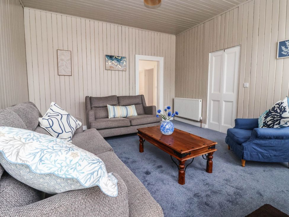 A living room with a sofa and coffee table at 154 Queen Street in Withernsea