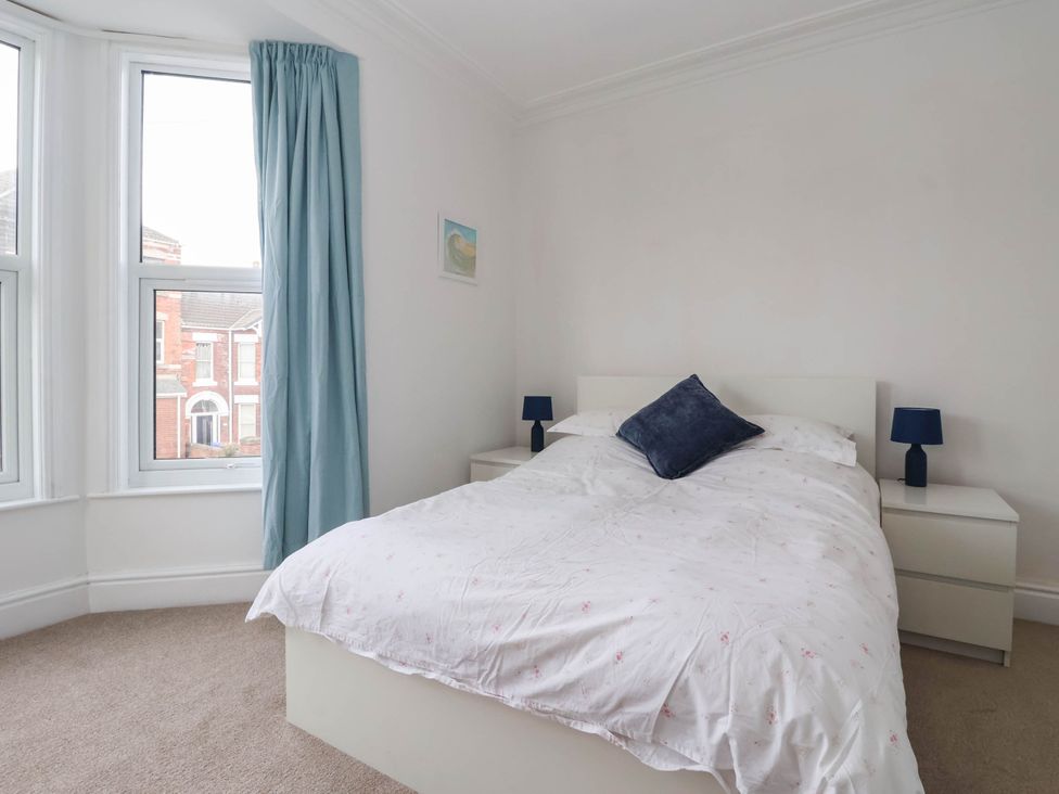 A bedroom with a bed and bedside tables at 154 Queen Street in Withernsea