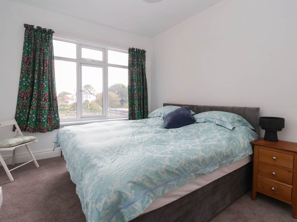 A bedroom with a bed and a bedside table at 154 Queen Street Withernsea