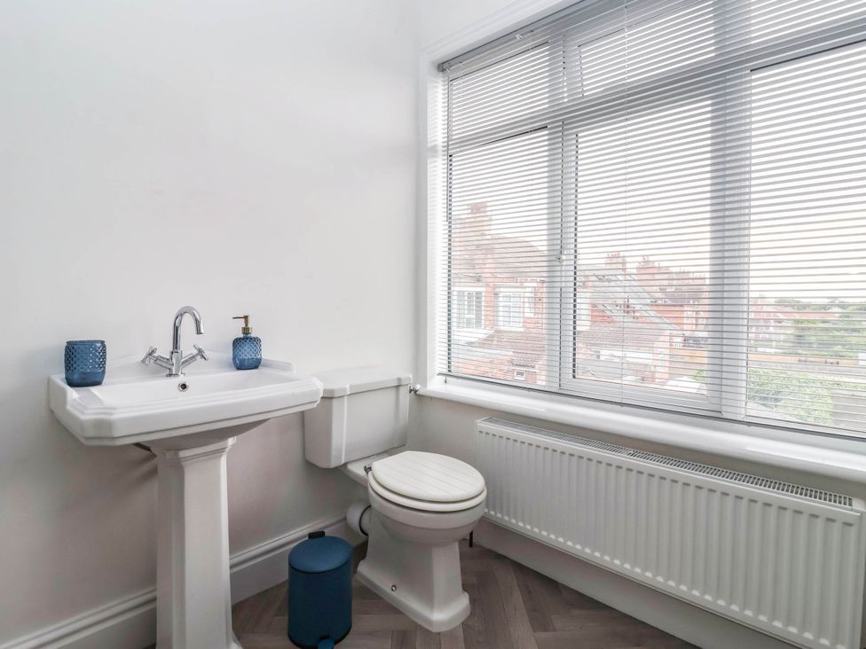 A bathroom with a sink and toilet at 154 Queen Street in Withernsea