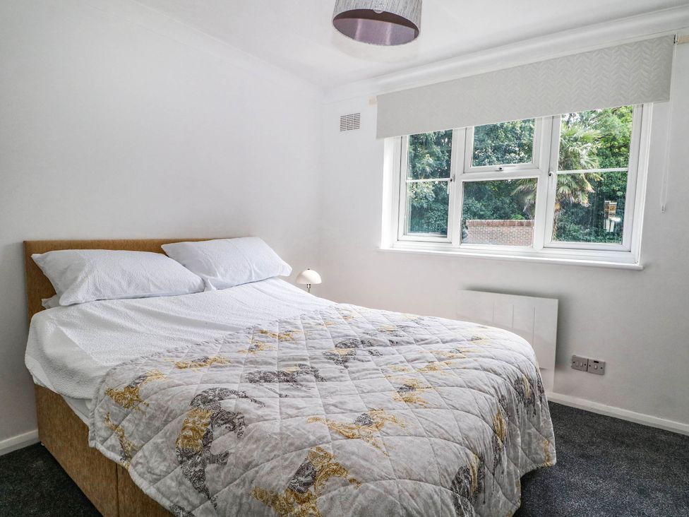 A bedroom with a bed and a window at 44 Court Road in Lewes, Sussex