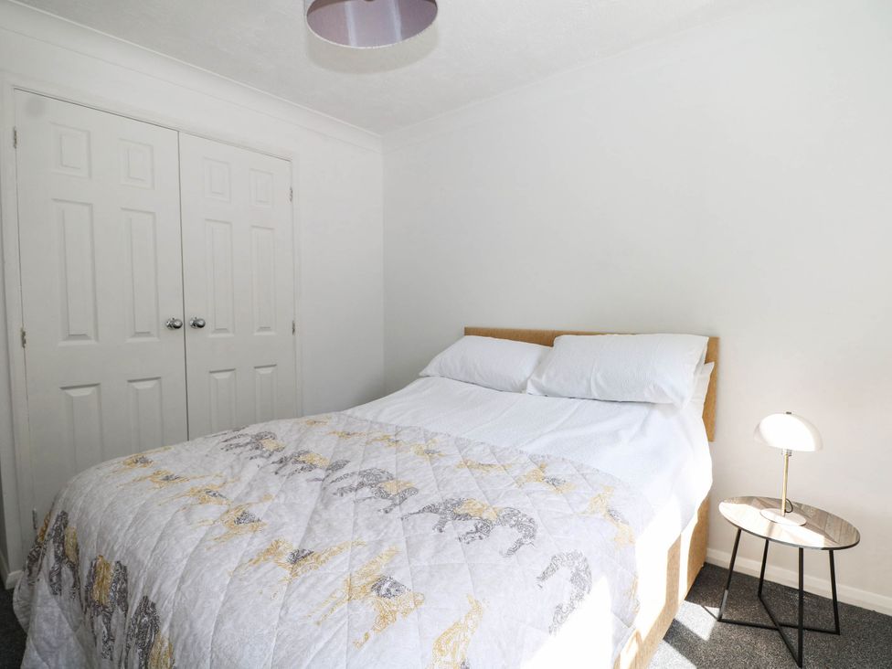 A bedroom with a bed and wardrobe at 44 Court Road Lewes, Sussex