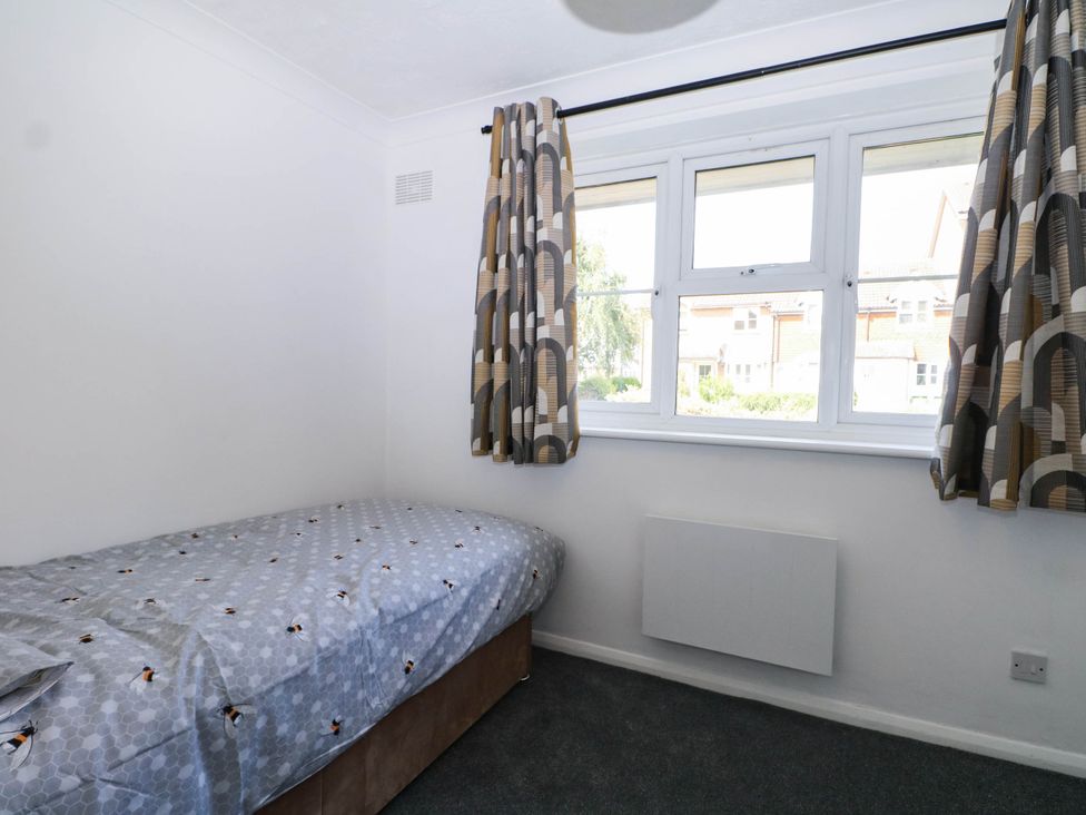 A bedroom with a bed and window at 44 Court Road Lewes, Sussex