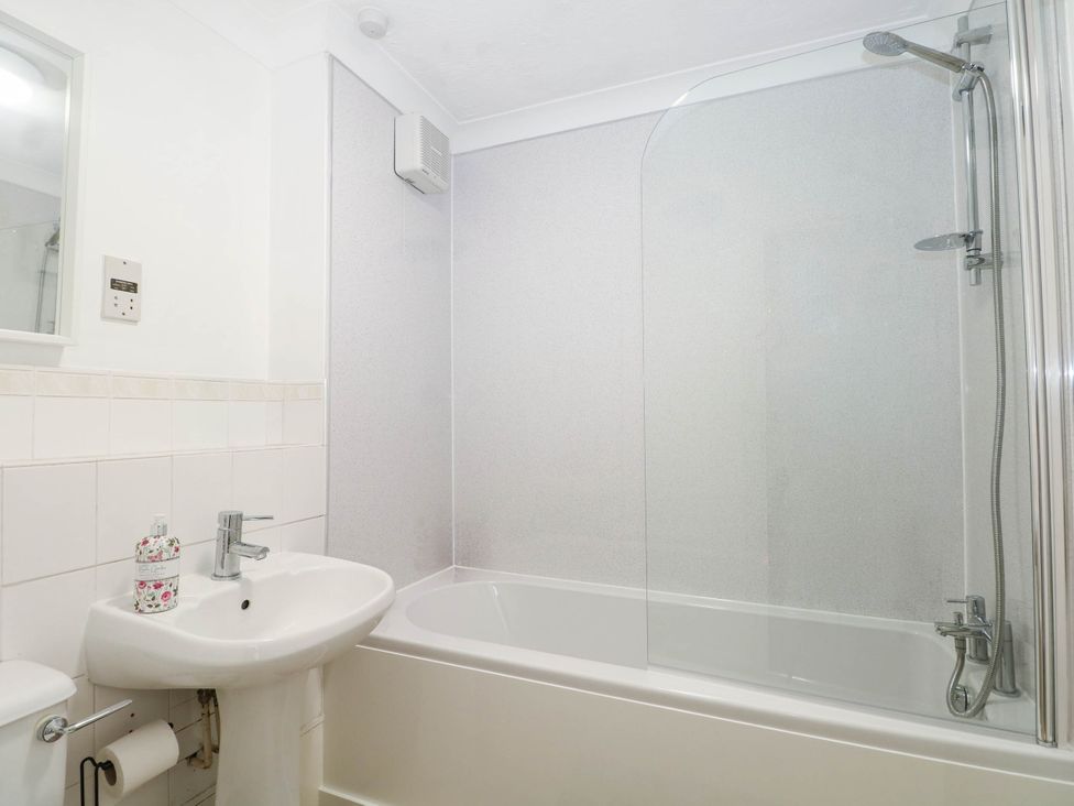 A bathroom with a sink and bathtub at 44 Court Road in Lewes, Sussex