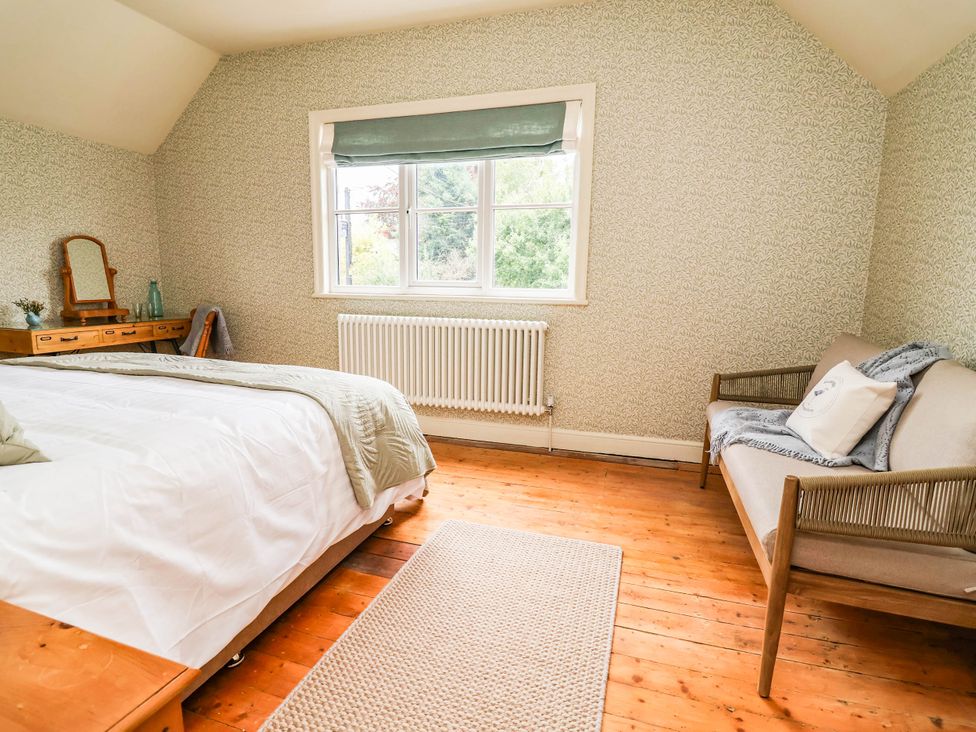 A bedroom with a bed and a window at Lyneal Cottage Ellesmere