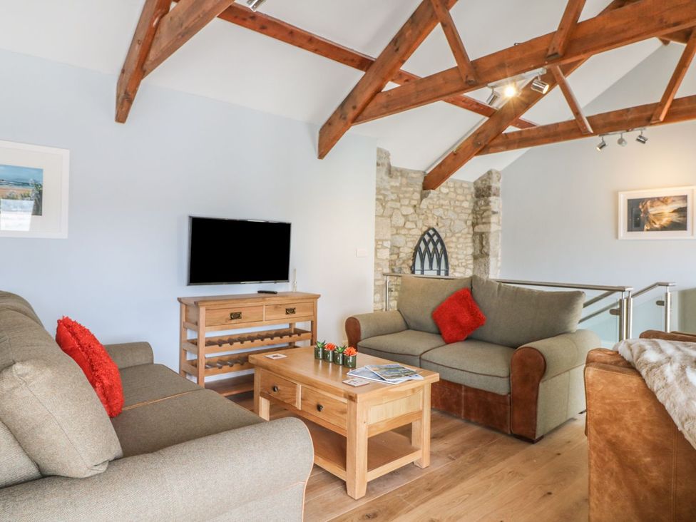 A living room with sofas and a coffee table at Helford in Treverva near Constantine