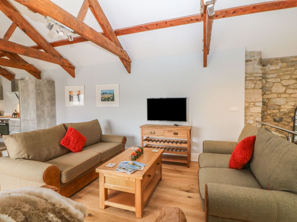 A living room with sofas and a coffee table at Helford in Treverva near Constantine