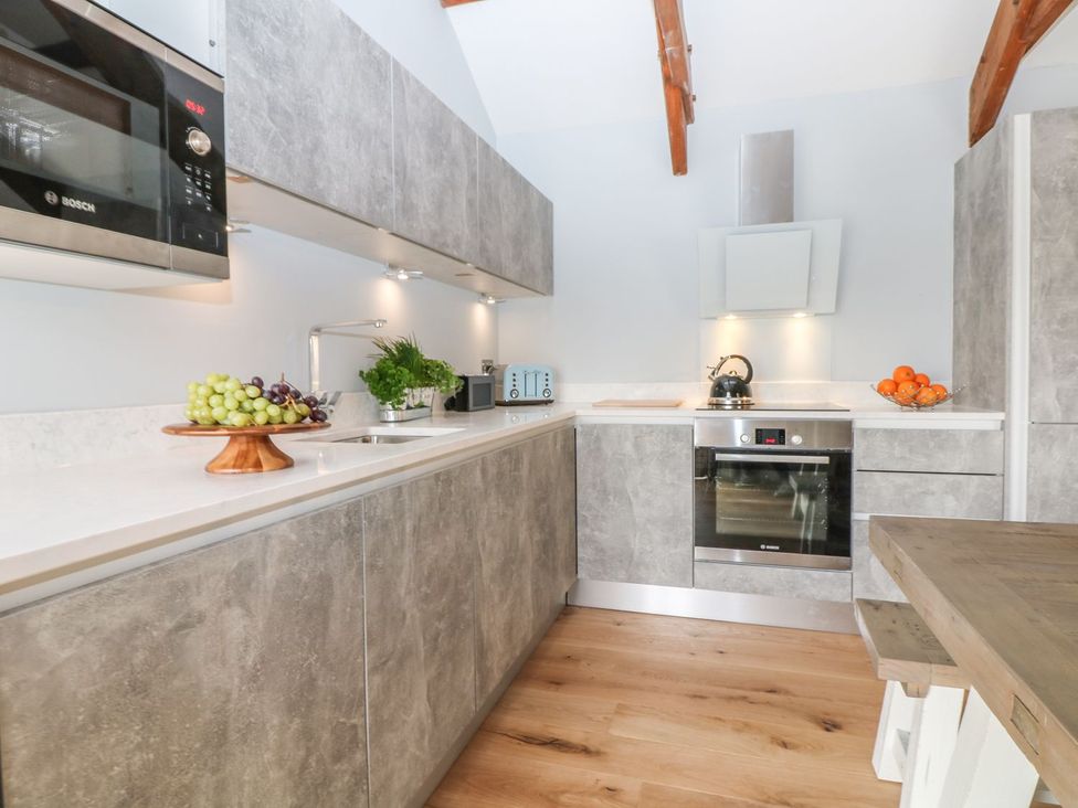 A kitchen with appliances and a fruit bowl at Helford in Treverva near Constantine